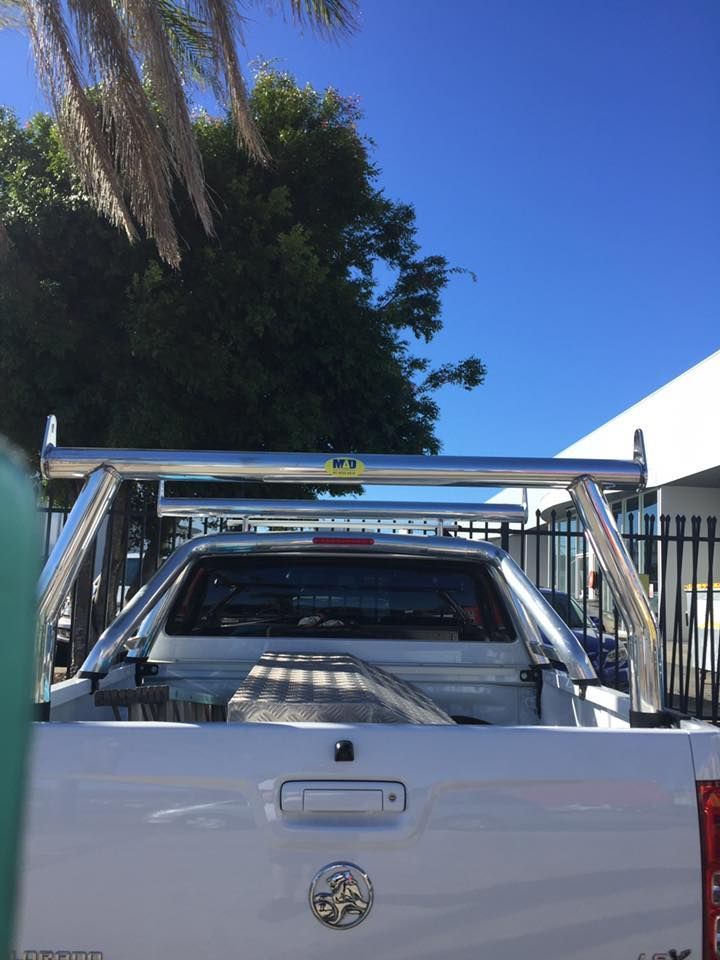 White Pickup Truck With Chrome Roll Bars, Under a Bright Blue Sky — Motor Accessories Direct In Southport, QLD