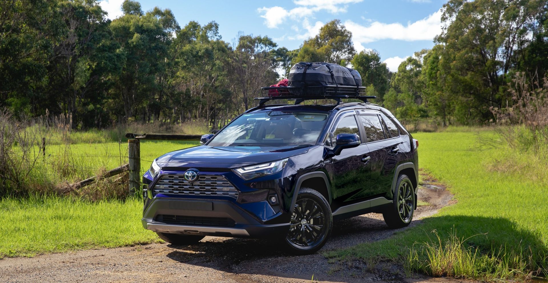 A BlackCar with A Roof Rack Attached to It — Motor Accessories Direct In Tweed Heads South, NSW