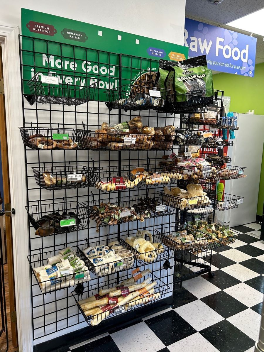 A store filled with lots of different types of food for dogs.