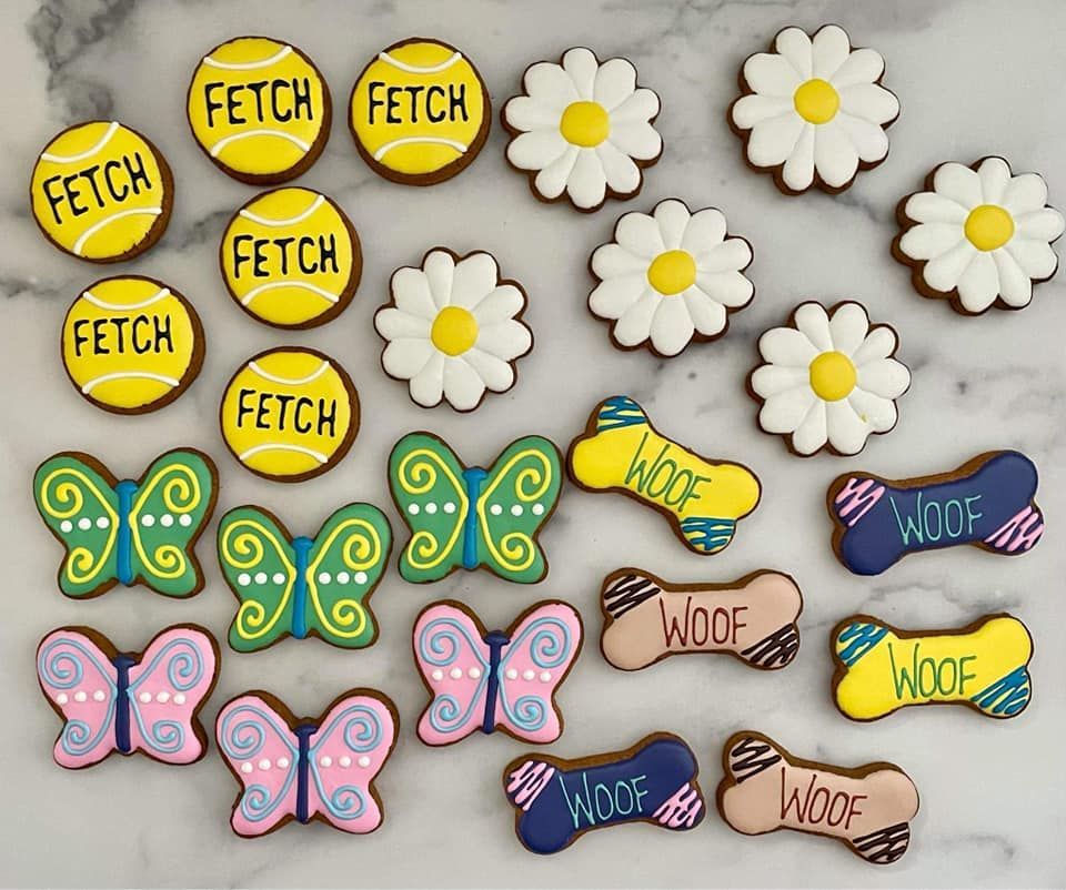 A bunch of cookies with the word fetch on them