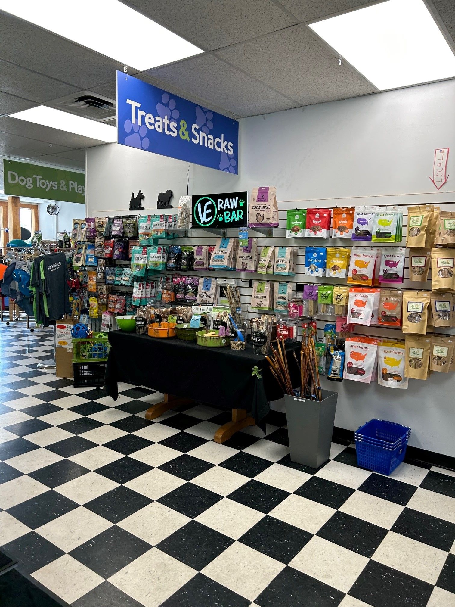 A store filled with lots of products and a checkered floor.