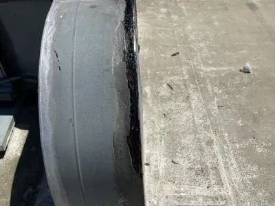 A close up of a tire on a concrete surface.