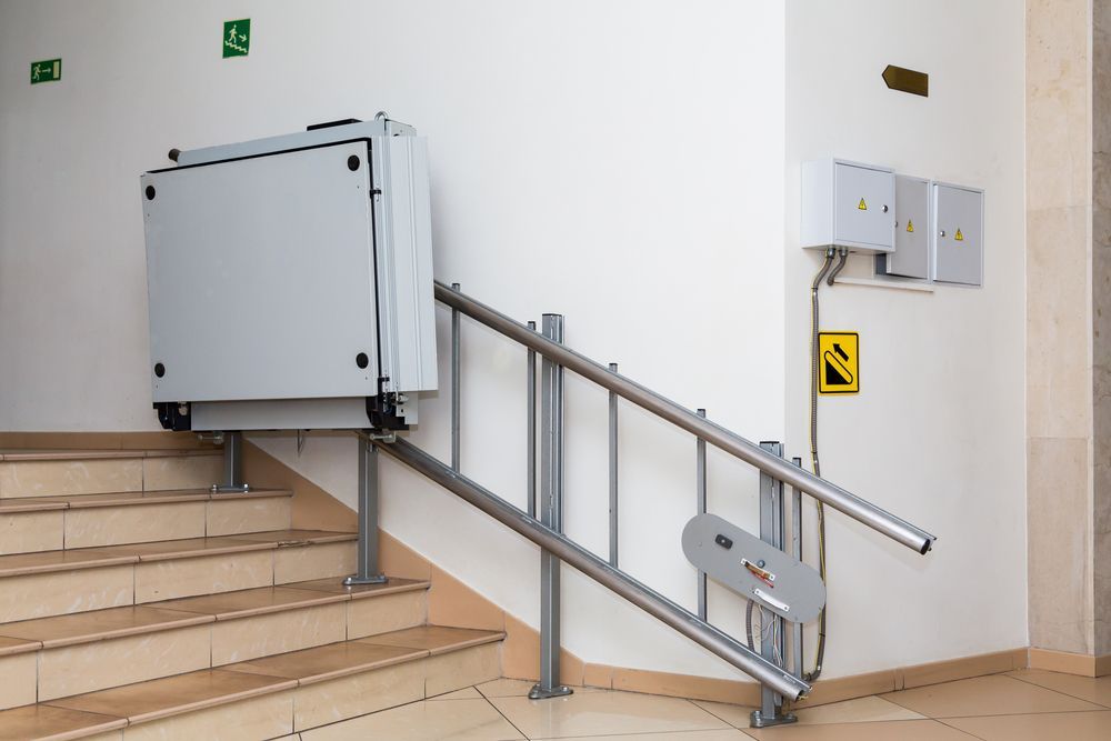 Stair Lift Installed On Staircase In A Building — Electrical & Air Cooling Solutions in Townsville, QLD
