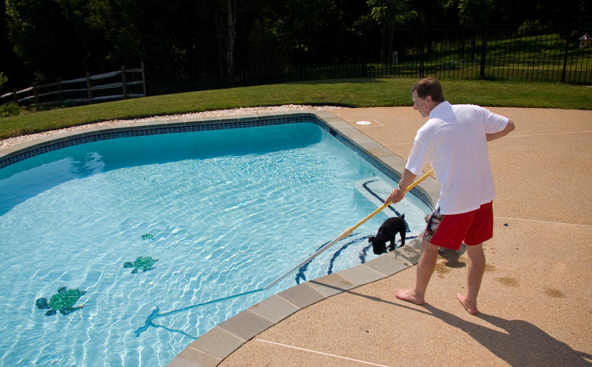 worker cleaning the pool