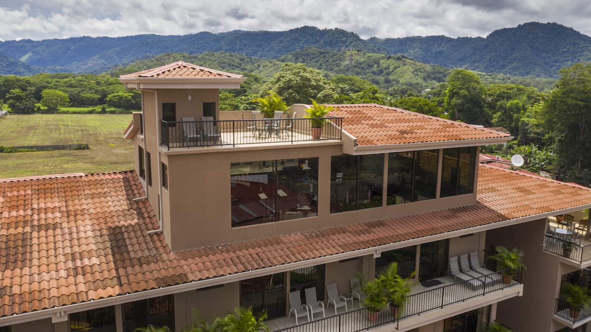 A large building with a balcony on the top of it