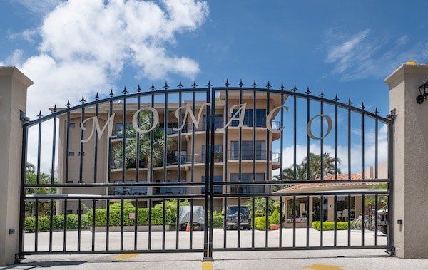 A wrought iron gate with the word monaco on it