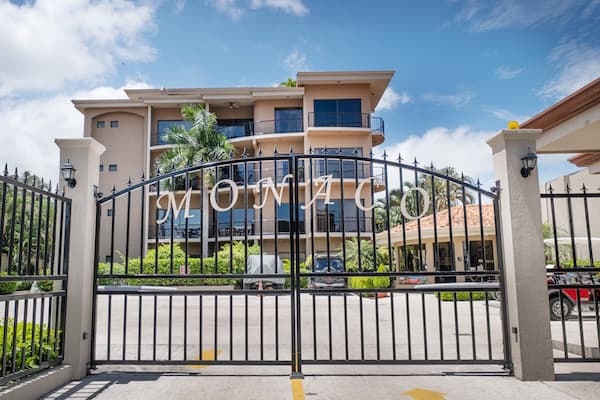 A wrought iron gate with the word monaco on it
