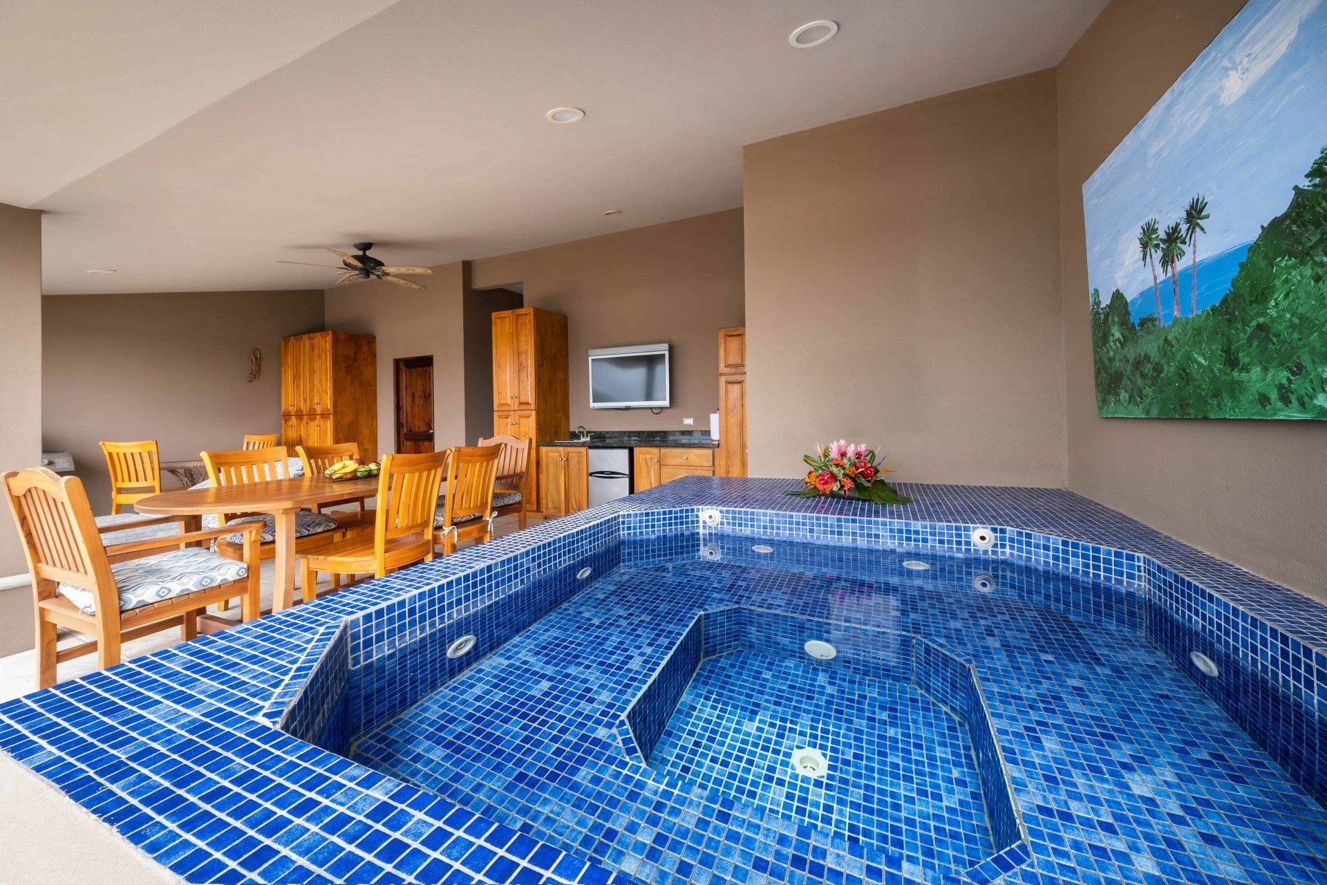 There is a large jacuzzi in the middle of the room.