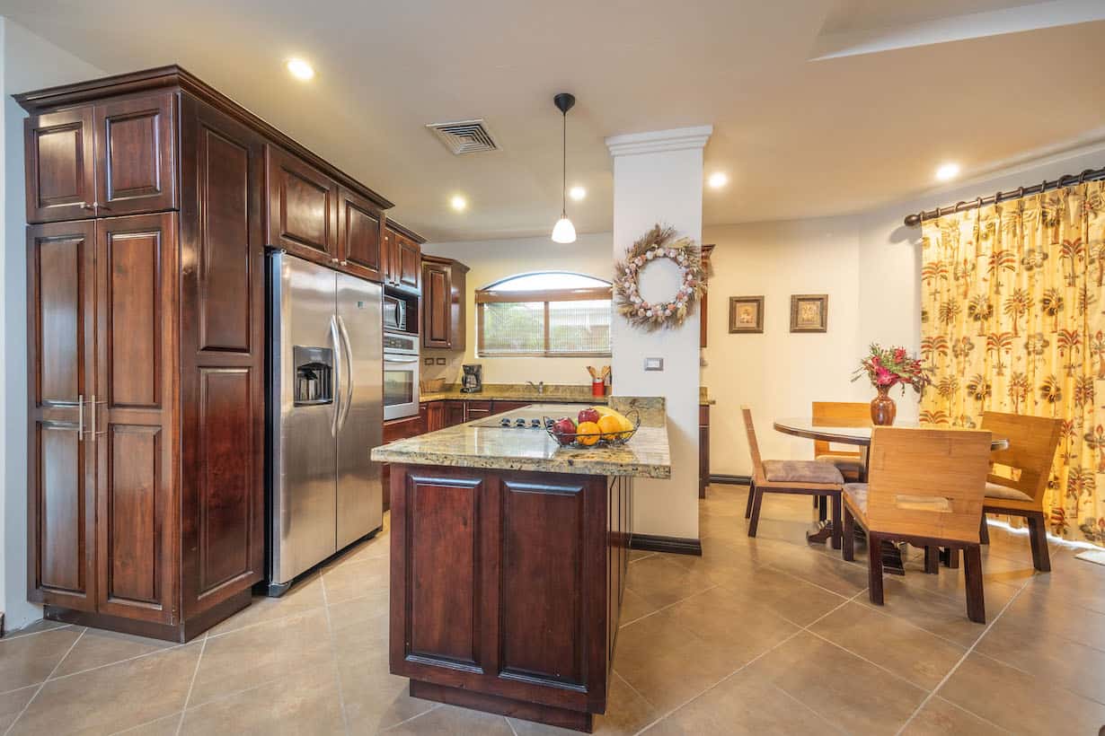 A kitchen with stainless steel appliances and wooden cabinets