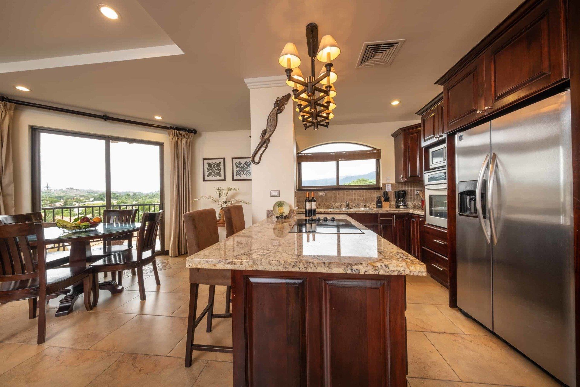 A kitchen with a large island and stainless steel appliances