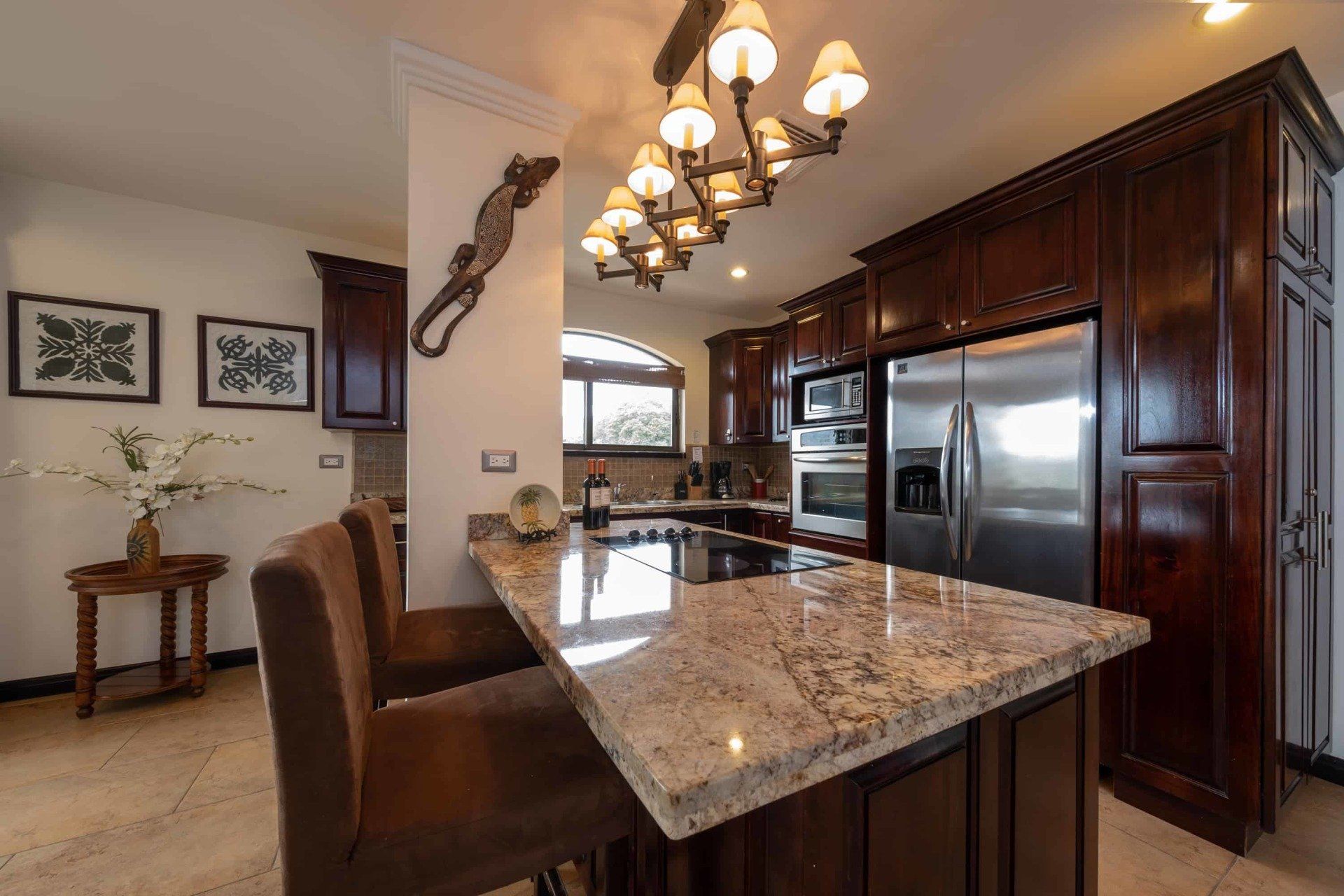 A kitchen with stainless steel appliances and granite counter tops