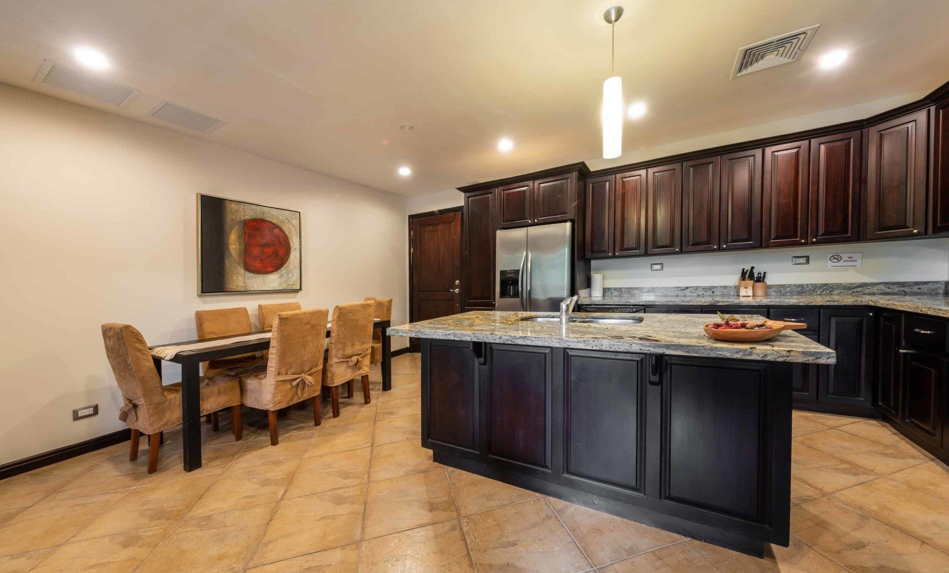 There is a large island in the middle of the kitchen.