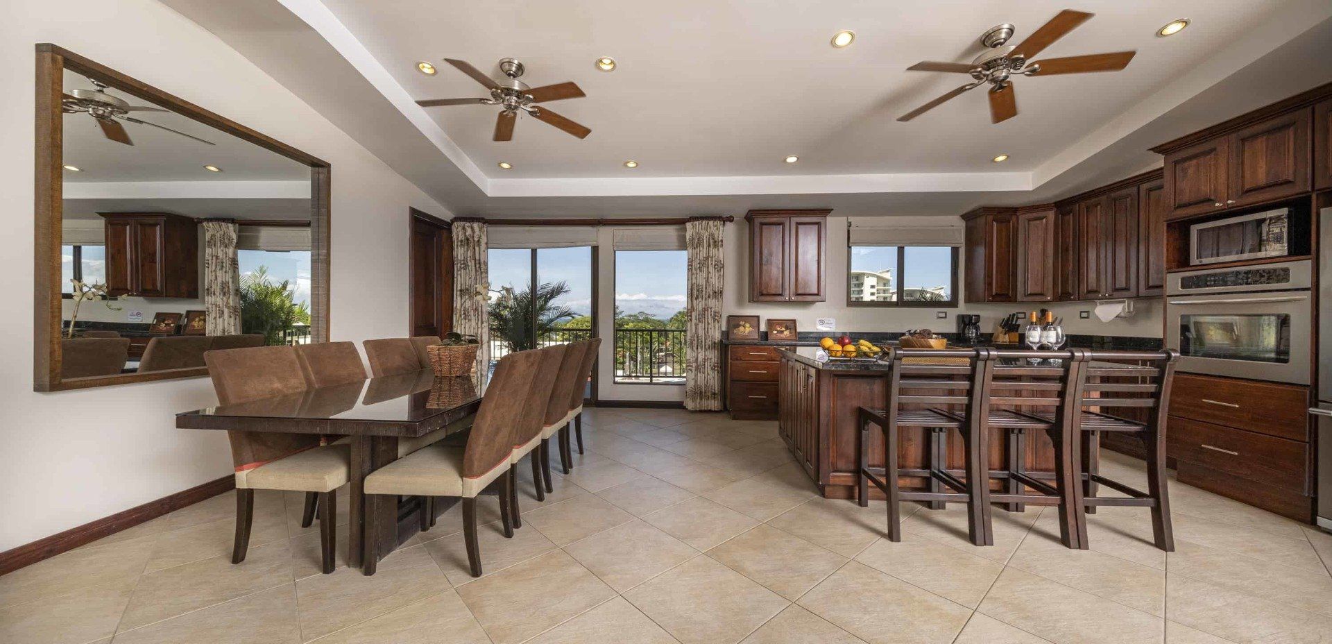 A large kitchen with a dining table and chairs