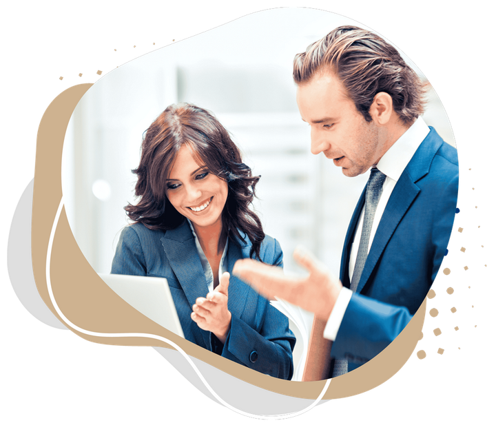 A man and a woman are looking at a piece of paper.