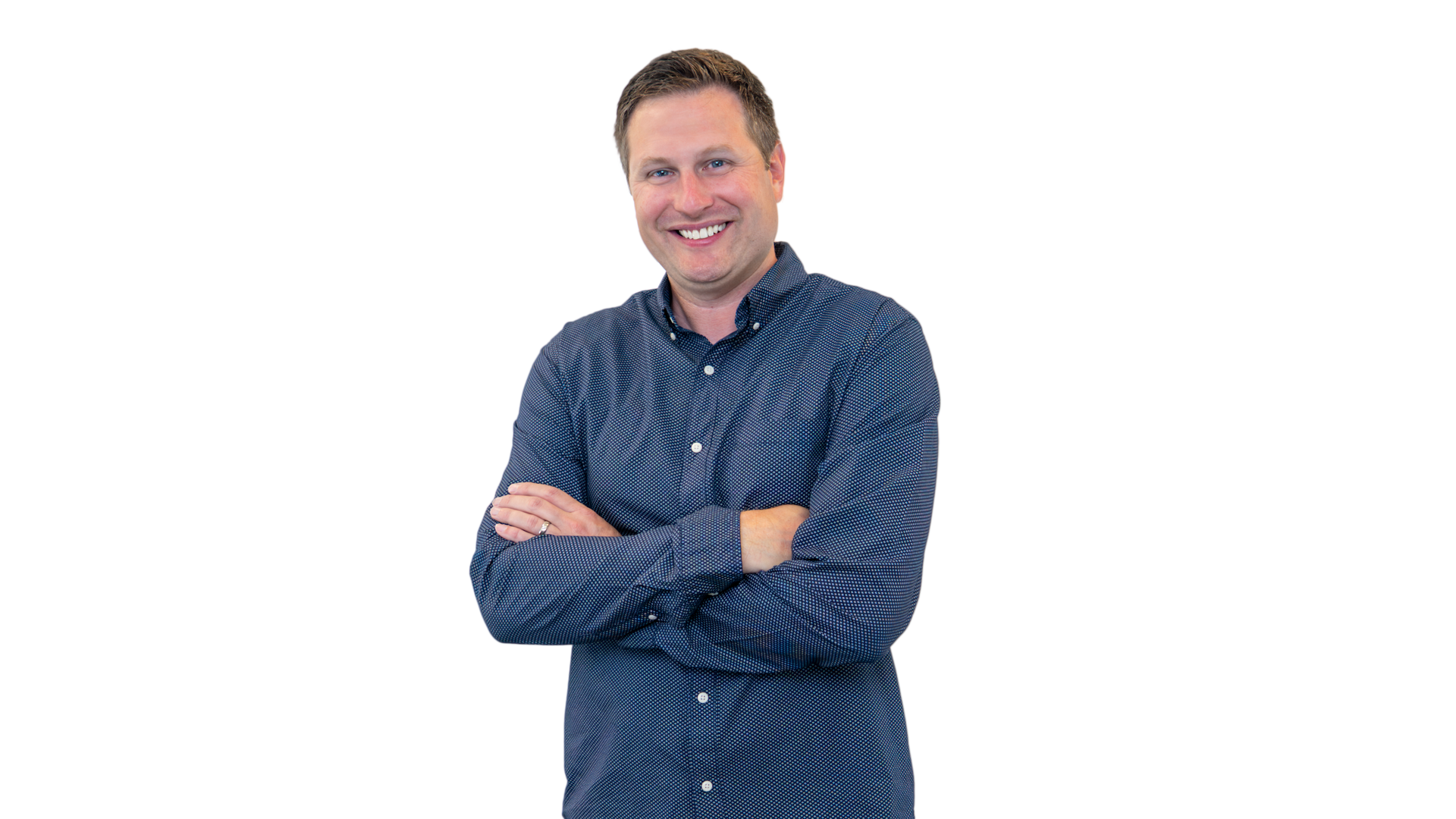 Smiling man in a blue button-down shirt and navy blazer, against a white background.
