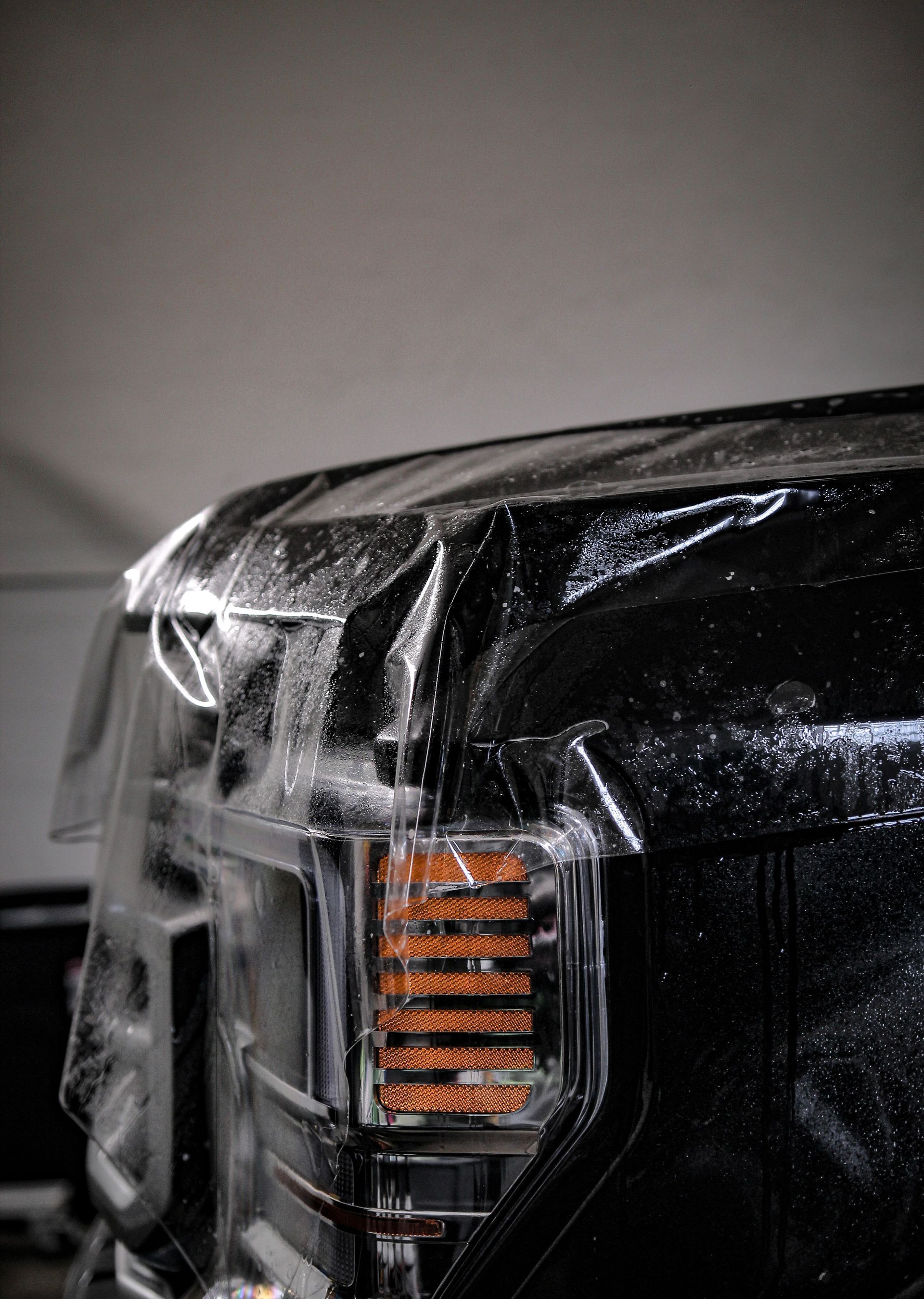 Black Toyota truck being detailed, front grill says 