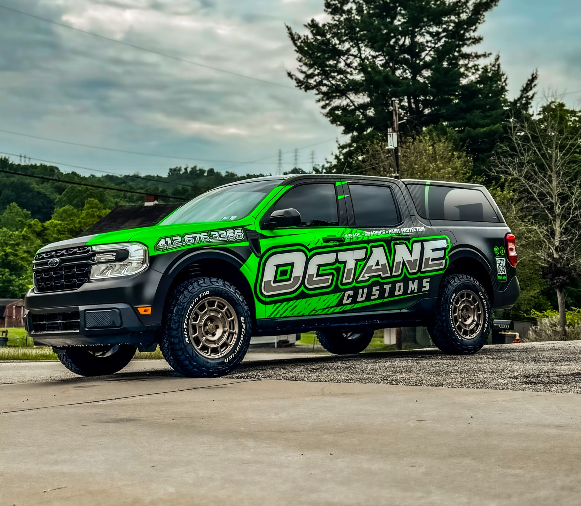 Green and black pickup truck with