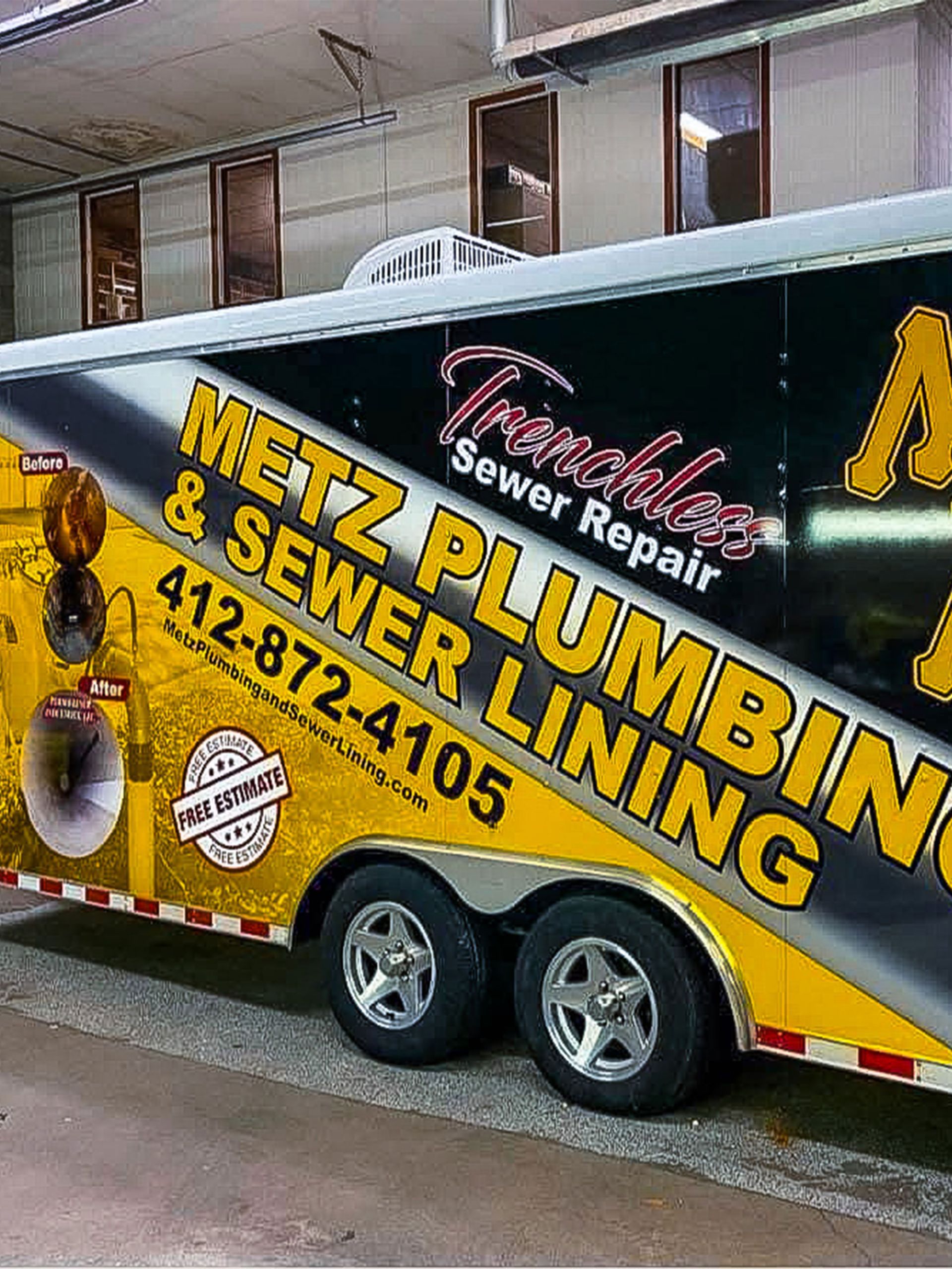 A trailer for Metz Plumbing & Sewer Lining, with company logo and phone number.