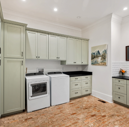 A laundry room with a washer and dryer in it