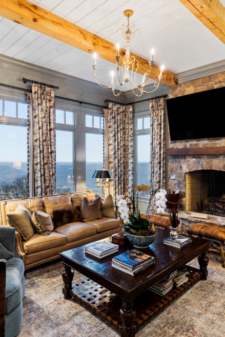 A living room with a couch a coffee table and a fireplace