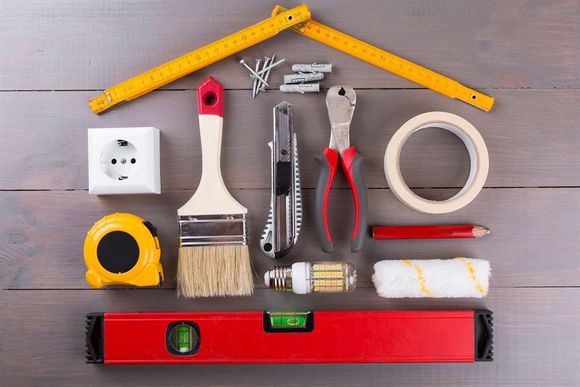 a group of tools arranged in a shape of a house