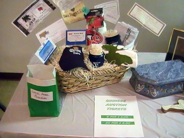 A table with a basket and a sign that says dinner appetizer tickets