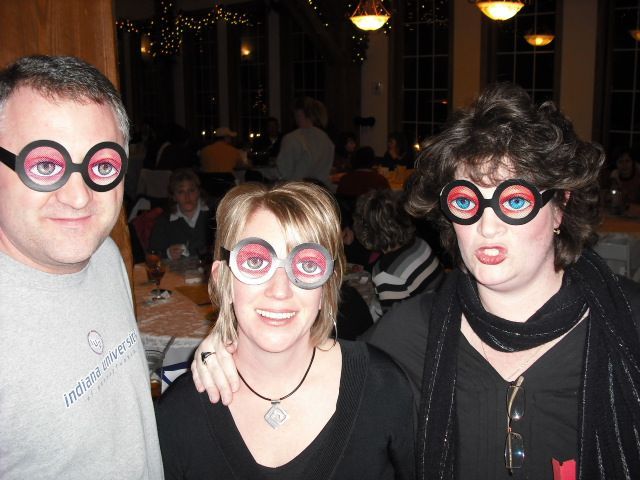 A man wearing a grey shirt that says ' abercrombie & fitch ' on it