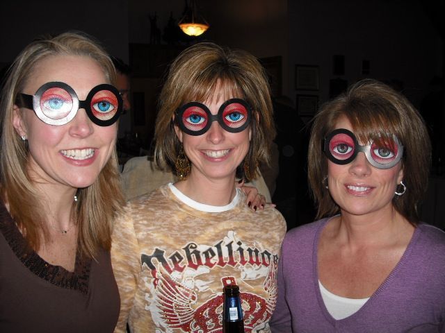 Three women wearing glasses and one wearing a rebellino shirt
