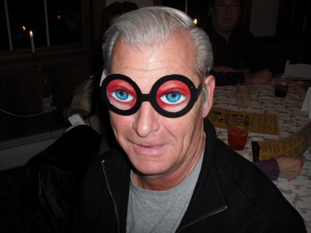 A man wearing a pair of glasses with blue eyes