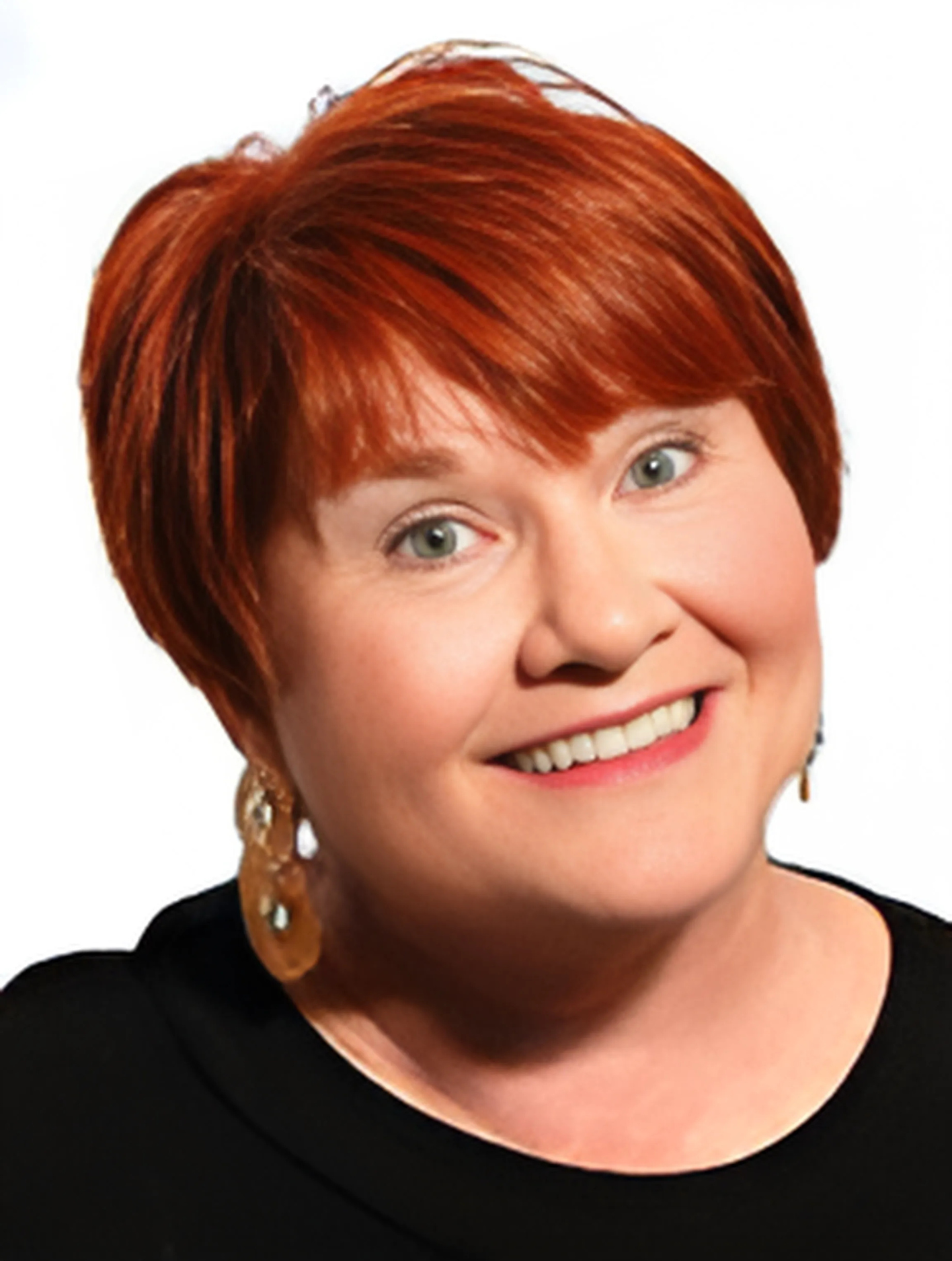 A woman with red hair is smiling and wearing earrings