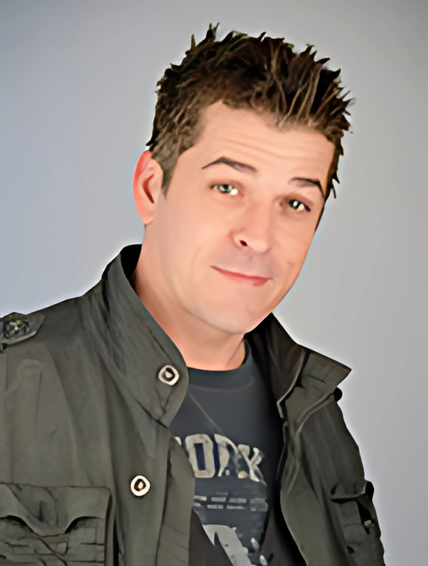 A man wearing a jacket and a shirt with the word york on it