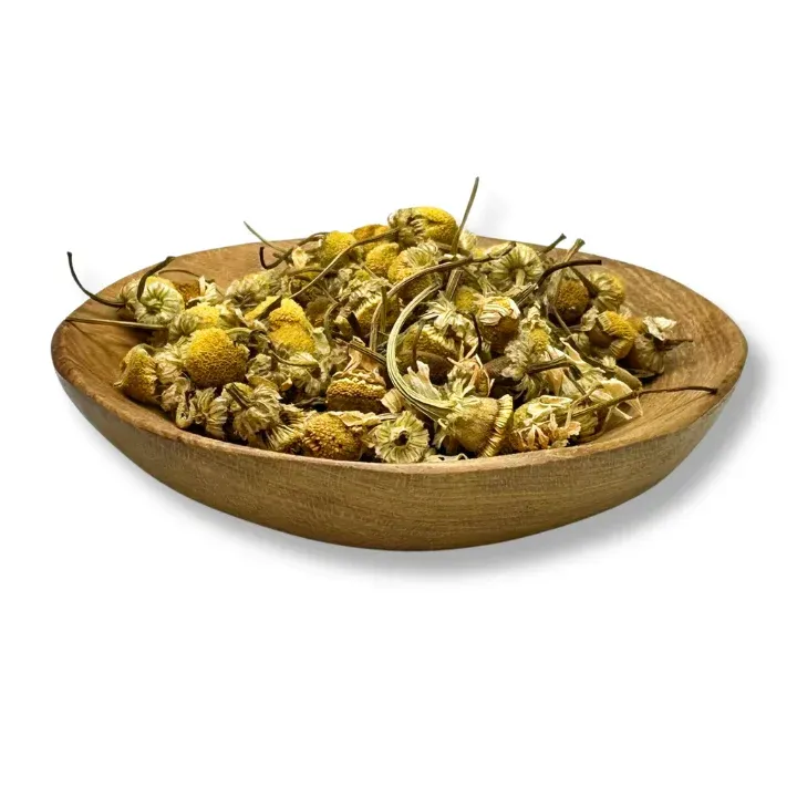 A wooden bowl filled with dried chamomile flowers— Atherton Health Food Centre in Atherton, QLD