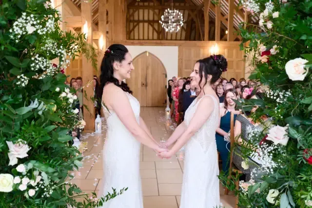 Gay couple posing for a wedding photo in Hampshire