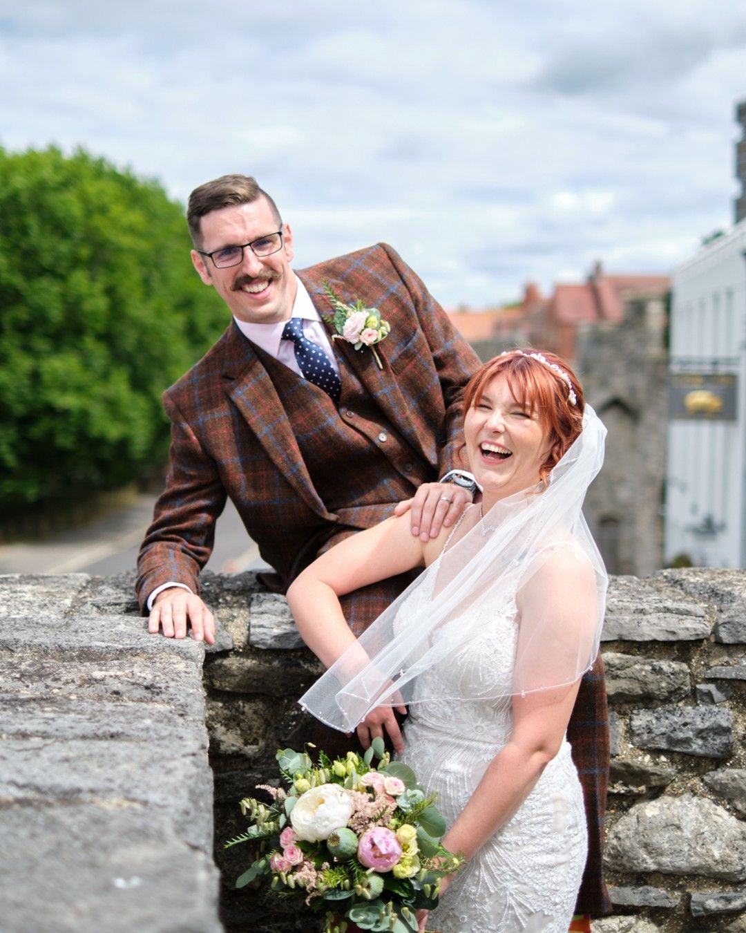 bride and groom laughing