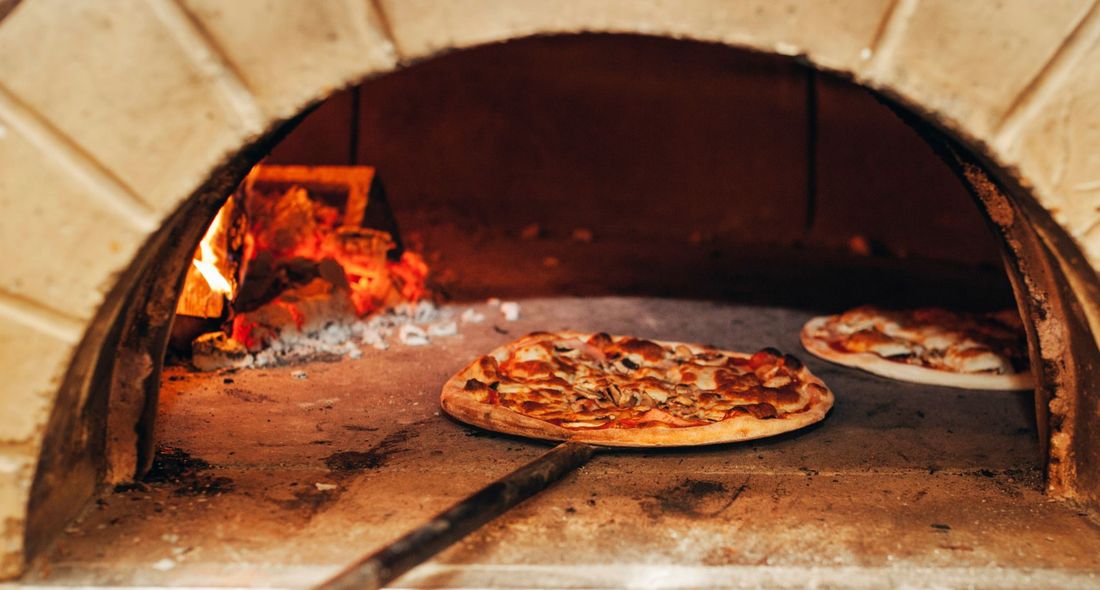 Pizza in a wood-fired oven