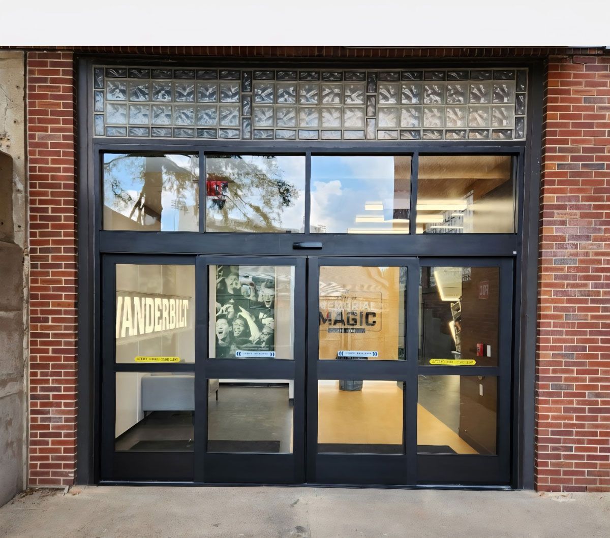 A brick building with a glass door and a sign that says vanderbilt