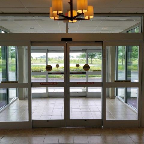 Automatic Doors Installation and Repair - A sliding glass door with a sign that says no entry