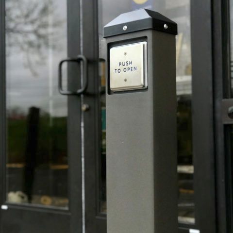 A door with a sign that says push to open