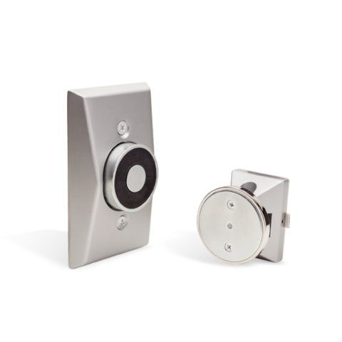 A close up of a door stopper and a door knob on a white background.