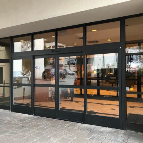 A building with a lot of windows and a sign that says peta