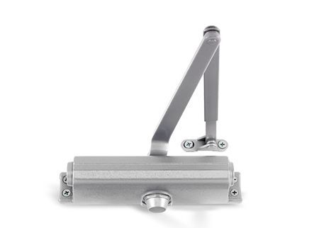 A close up of a door closer on a white background.