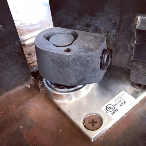 Door Closers Installation and Repair - A close up of a metal object with a label that says ul on it