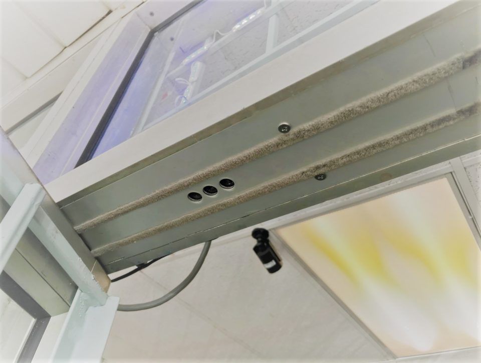 Door Closers Installation and Repair -  A close up of a metal structure with holes in it