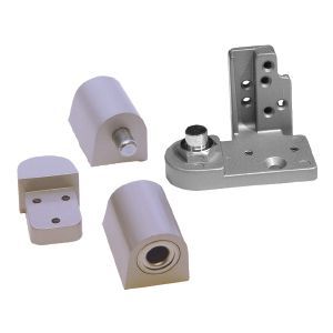 Hinges & Pivots - A bunch of pieces of metal are sitting on top of each other on a white surface.