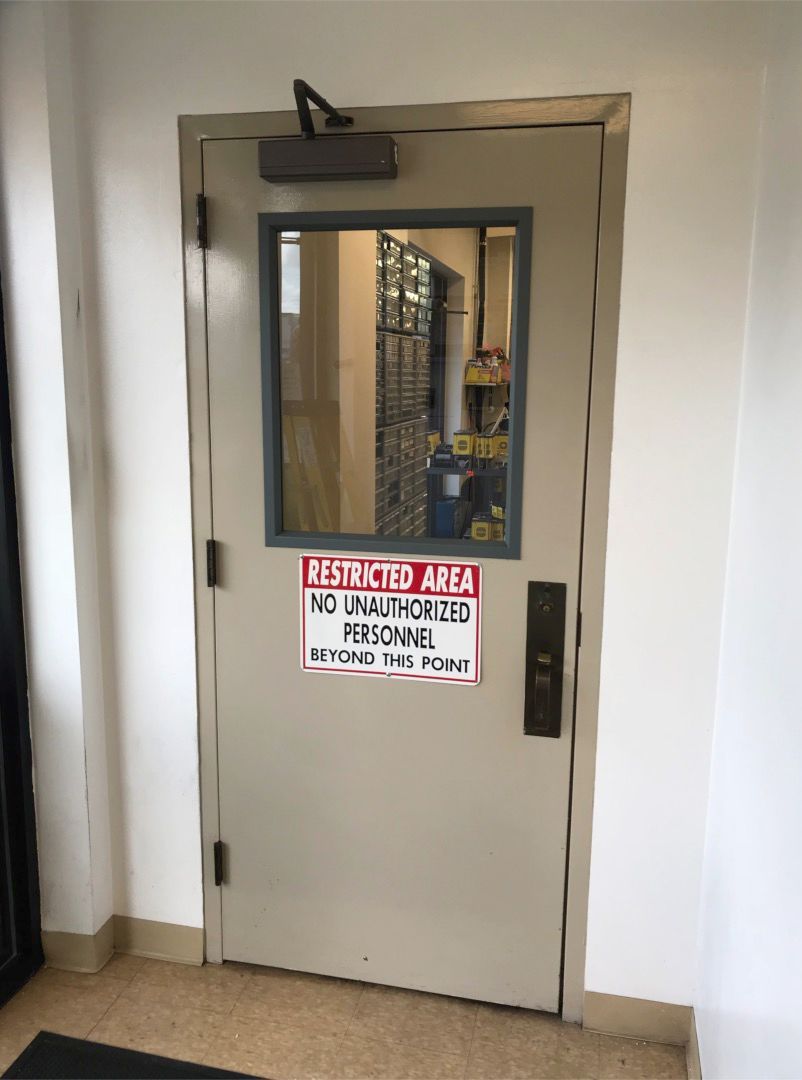Hollow Metal Doors Installation and Repair - A door with a sign on it that says restricted area