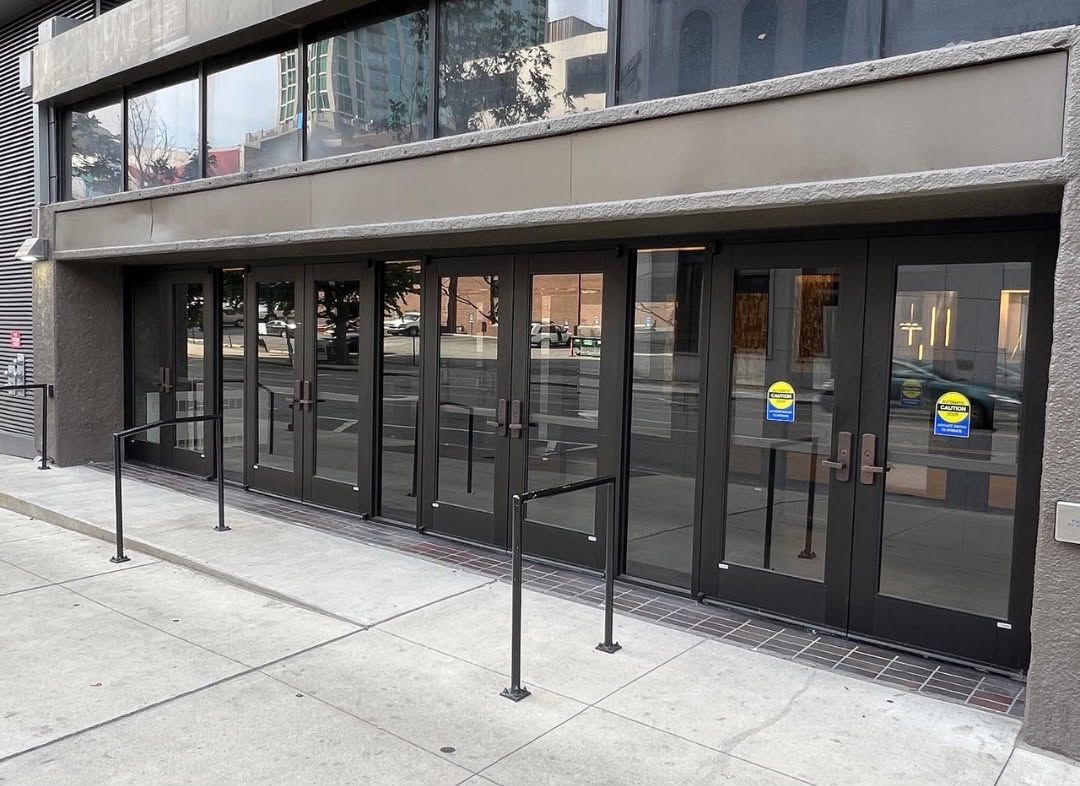 A large building with a lot of windows and doors.