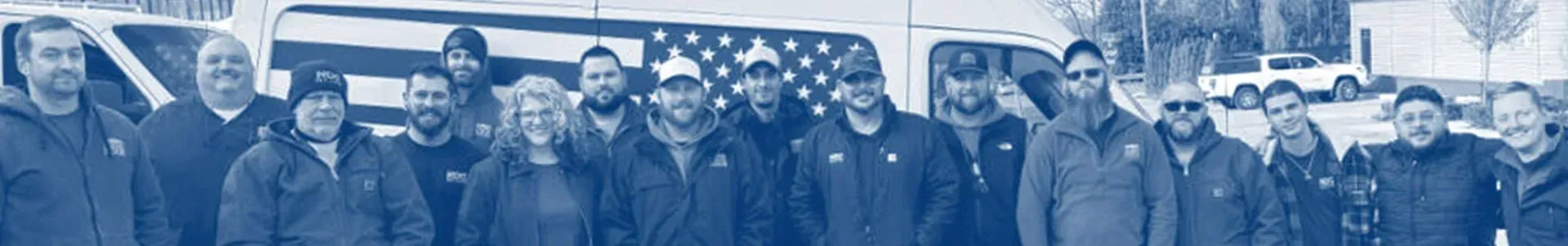 A blurry picture of a group of people standing in a line.