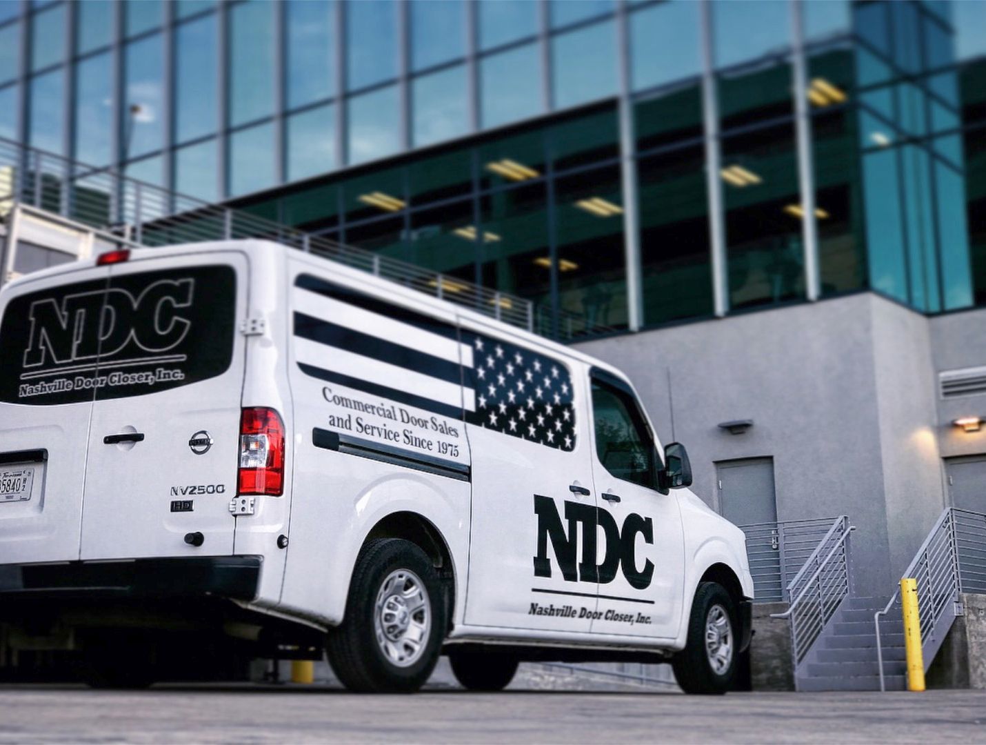 Storefronts & Glass Doors Installation and Repair person in a white van