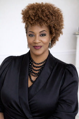 A headshot of Tiffany D. Singleton, Lead Designer & Owner, smiling against a gold brushstroke background.