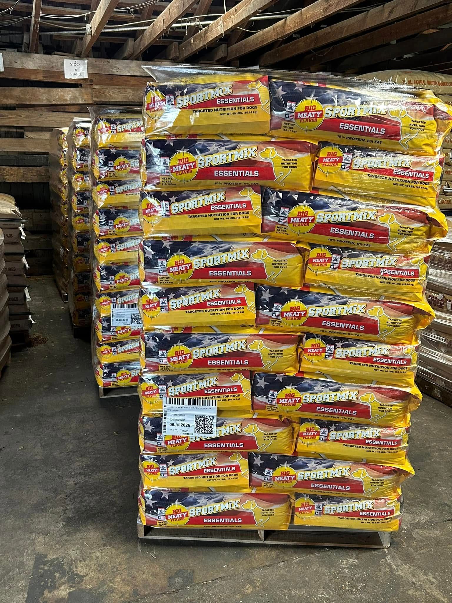 A warehouse filled with lots of bags of food stacked on top of each other.